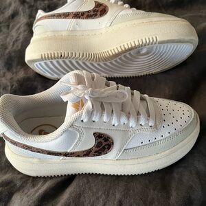 White Nike Sneakers with Leopard Accent